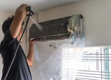 guy cleaning a/c