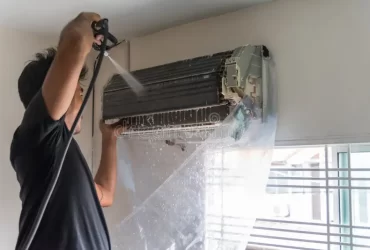 guy cleaning a/c