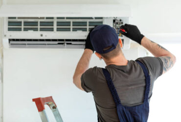 guy installing a/c